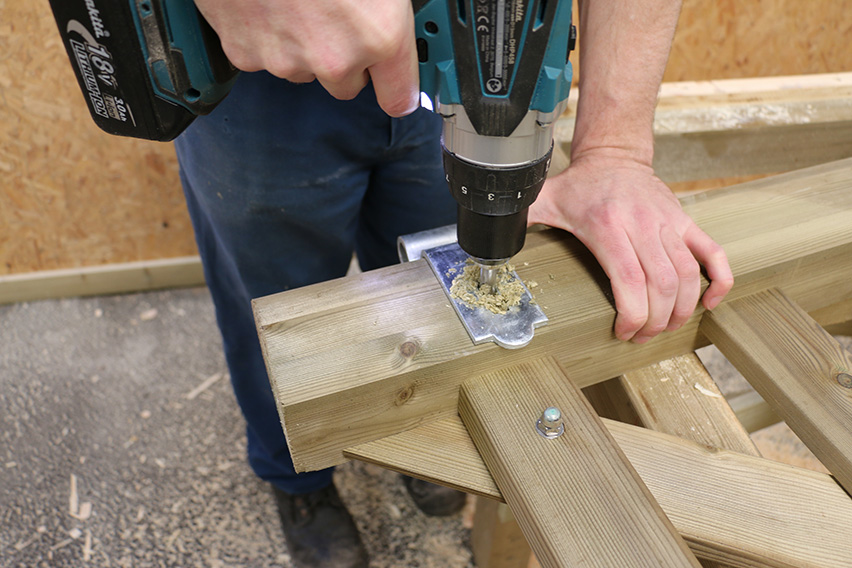 Drill out the hole for the single bolt that attaches it to the bottom of the gate.