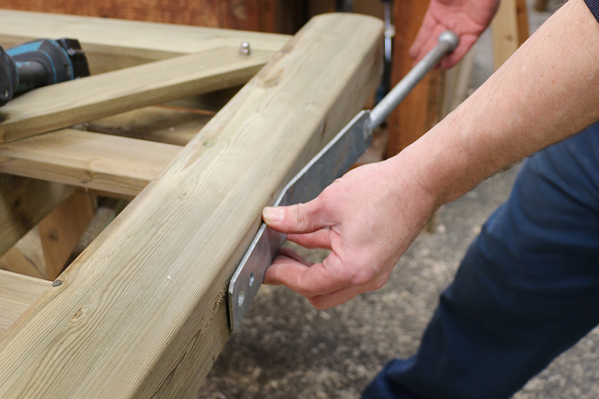 The spring fastener is the final piece of metalwork to be fixed to the gate and the handle should be flush to the top of the gate.