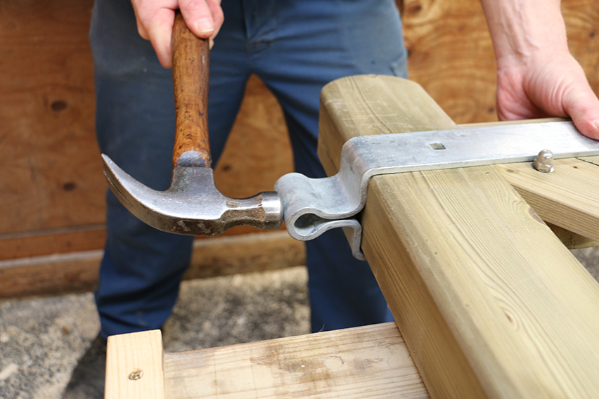 Use a hammer to knock the band up as tight as possible to the gate.