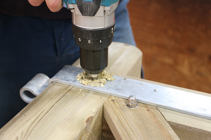 Carefully drill each of the three holes.
